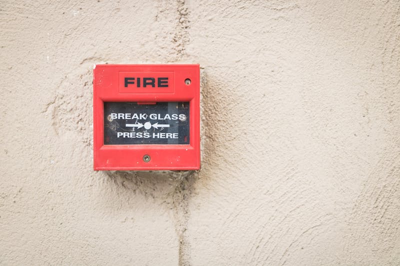 Fire alarm call point on wall
